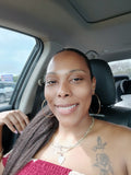 Woman wearing kinky straight weft extensions in sleek ponytail showing natural blend and textured straight hair in real life lighting