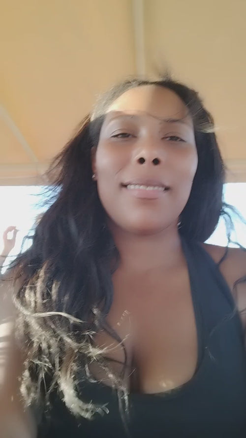 Kinky straight weft extensions worn on vacation showing natural movement and humidity performance